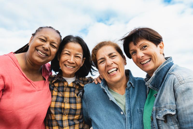 Diverse Older Adult Friends Smile Outdoors